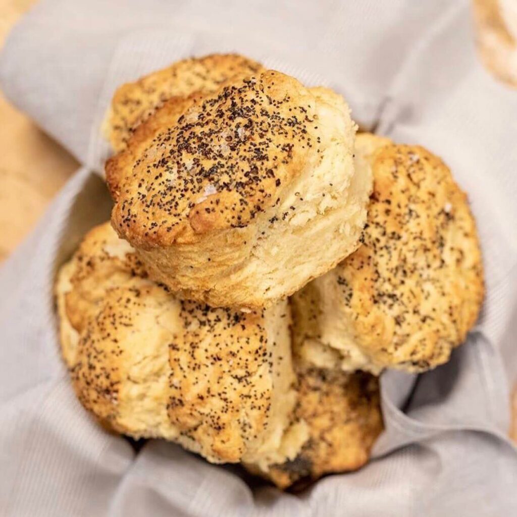 basket of poppy seed biscuits on a table